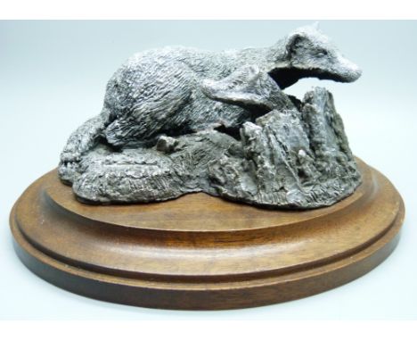 A hallmarked silver badger figure group, marked 'Filled' 