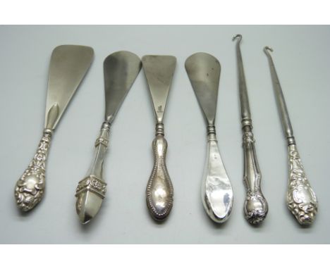 Six silver handled tools, two button hooks and four shoe horns 