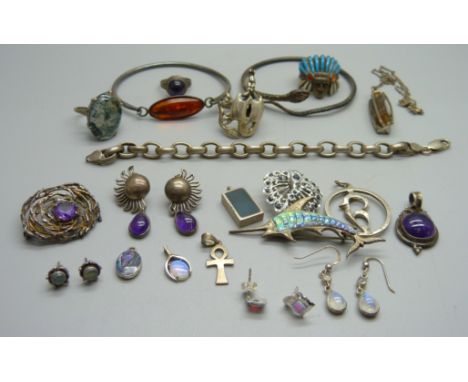 A silver snake bangle, one other silver bangle, a silver and moss agate ring, three other rings, a silver bracelet, etc. 