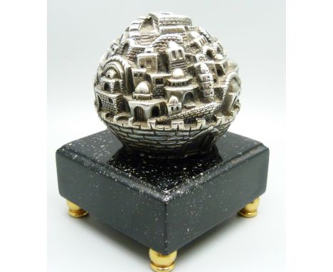 A silver paperweight/desk ornament 