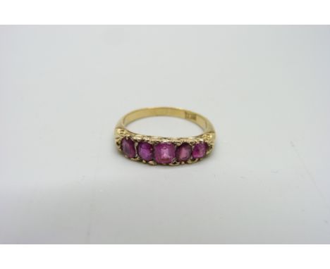 An 18ct gold and five stone ruby ring, 3.1g, M 