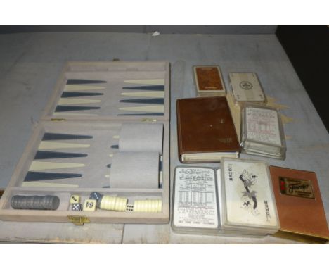 A games compendium and a quantity of playing card sets 