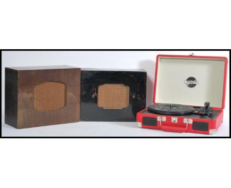 A Retro portable red leatherette cased record player with two vintage 1930's decorative gloss painted wooden speakers, please