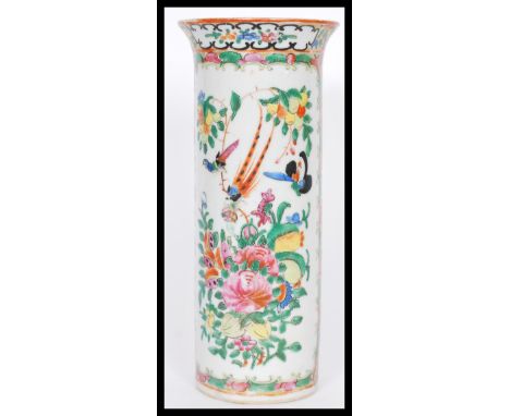 A 19th century Chinese Canton enamel tall cylindrical vase having a flared rim. Hand decorated with floral borders and white 