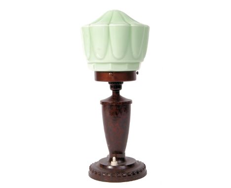 An Art Deco early 20th century Bakelite table lamp having a stepped base with urn pedestal and waisted neck stamped WG to bas