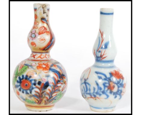 Two 19th century miniature Chinese ceramic vases, one having hand painted blue and white floral sprays, and the other having 