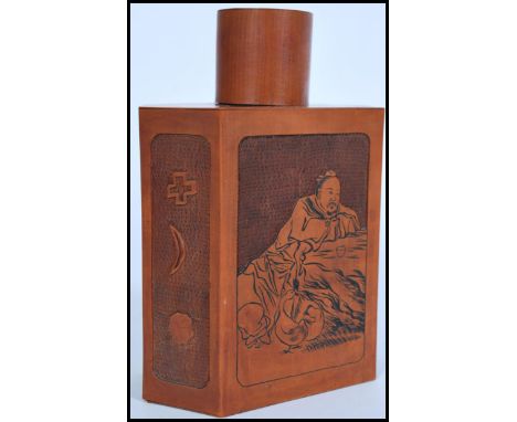 A 19th century carved Chinese wooden tea caddy of hexagonal form having hand carved scenes of an Elder with character marks. 