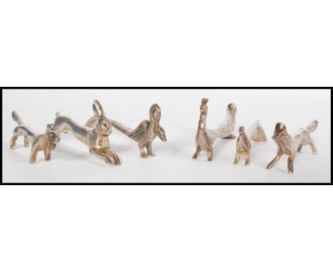 A set of six silver plated knife rests in the form to animals including a hare, a dog, a swan, a fox, a peacock and a bird, s