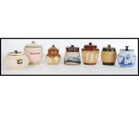 A collection of vintage 20th century tobacco jars to include a Carlton ware pink tobacco jar reading 'TOBACCO' to the side, a