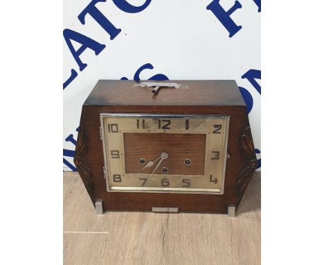 LATE 19TH CENTURY CARVED OAK MANTLE CLOCK WITH KEY AND PENDULUM