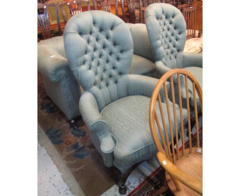 Early 20th Century upholstered button back, blue ground three piece suite comprising two seater sofa and a pair of armchairs.