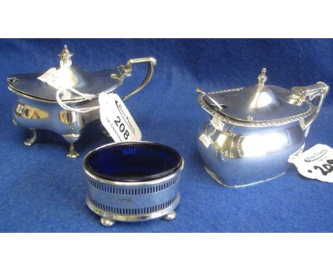 Group of three silver cruet items to include: open salt with blue glass liner; lidded serpentine mustard with blue glass line