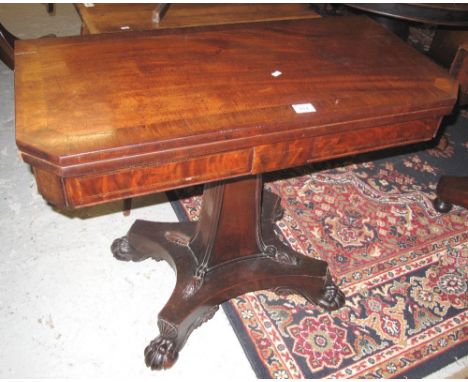 19th Century mahogany card table on quatraform base with carved claw feet.(B.P. 24% incl. VAT)