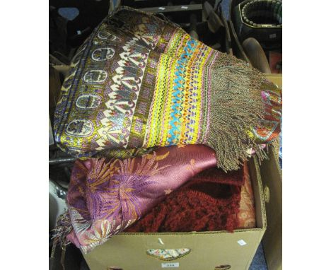 Box of assorted textiles to include: Egyptian design embroidered fringed throw, a similar pink ground throw with figural and 