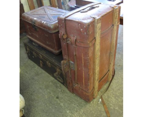 Vintage tin trunk, together with a metal mounted tin trunk, together with another vintage leather travelling trunk (3).(B.P. 