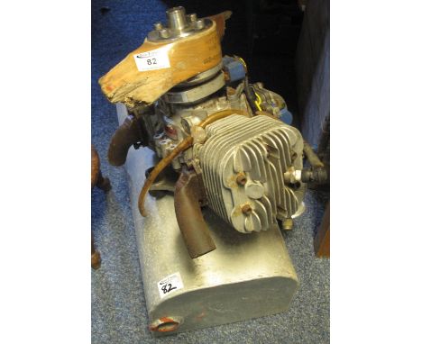 Small two cylinder air cooled petrol engine with single carburettor, direct drive to a propeller boss, the wooden propeller b