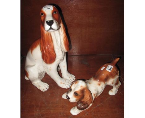 Two Italian ceramic fireside dogs, a Spaniel with pup. (2)(B.P. 24% incl. VAT)