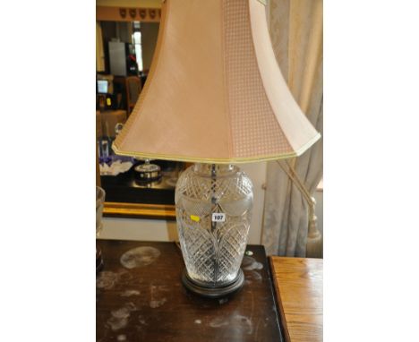 A CUT GLASS BALUSTERED TABLE LAMP WITH SHADE, 20cm in diameter and 78cm to top of shade