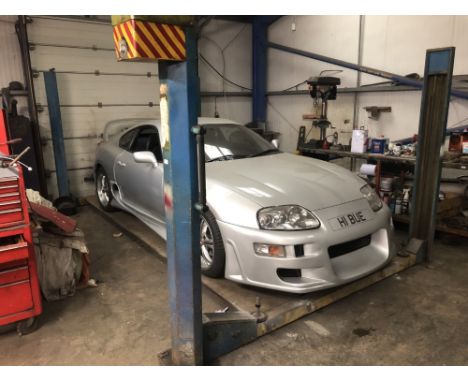 A Kismet 2000 four pillar vehicle lift and jack.