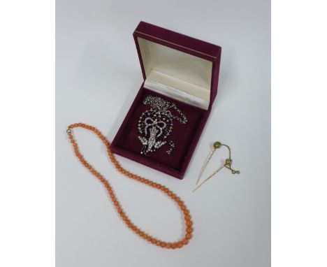 Vintage coral beads, yellow metal and turquoise tiepin and a paste set pendant on silver chain (3) 