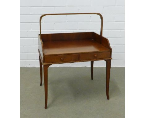 Mahogany table with looping handle, two short drawers and tapering outswept legs, labelled inside drawer Old Colony Furniture