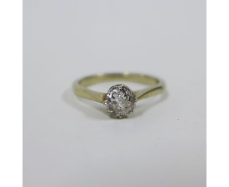 Solitaire diamond ring, claw set with a single old round cut diamond to a plain white metal band, unmarked, UK size M 