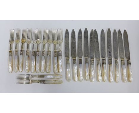 A set of mother of pearl handled fruit knives and forks (a lot) 