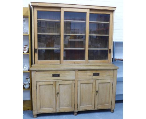 Pine dresser, cornice top over three glazed doors with a shelved interior above two drawers and pair of panel cupboards, 162 