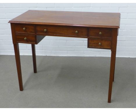 Mahogany writing desk / table, the rectangular top with moulded edge over an arrangement of five drawers, straight square leg