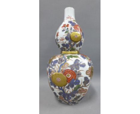 Japanese double gourd vase of octagonal form, double walled with pierced chrysanthemum panels and painted with flowers and fo