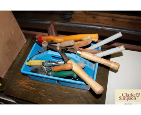 A tool crate containing a good selection of gardening tools 