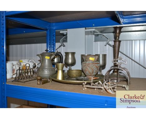 A quantity of various metalware to include a large candle stick; a toast rack and goblets etc