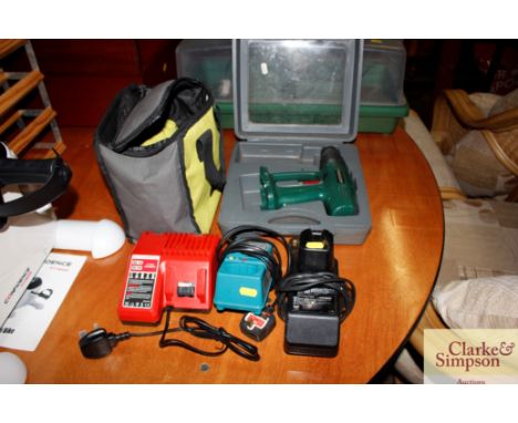 A Parkside cordless drill - lacking charger and battery; Ryobi tool bag; a Milwaukee compatible cordless charger; a Makita fa