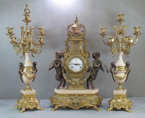 Modern Louis XV style French gilt metal clock garniture, the clock of lyre shape with foliate mounts and two satyr figures, h