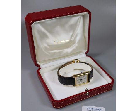 Cartier gold plated on silver marked 925 Tank watch having Roman numerals, sweep second hand and date aperture, sapphire set 