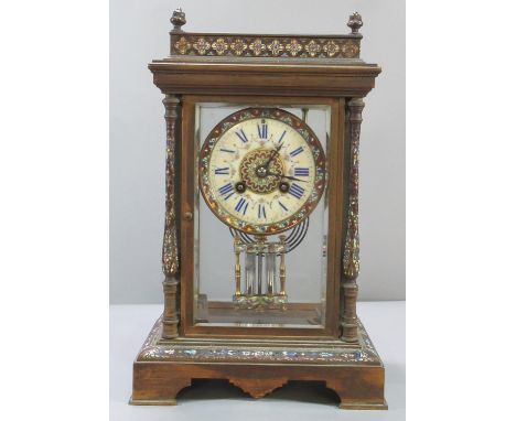 Late 19th century French Champleve enameled four glass mantle clock with overall foliate decoration, porcelain face with Roma