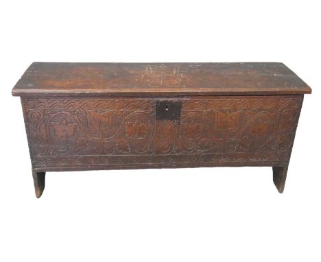 Early 18th century oak plank coffer, the moulded top carved and dated '1706' with initials 'I E' above a carved front panel o