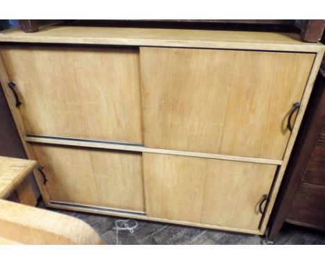 A light oak cabinet with four sliding doors 3'6 wide 