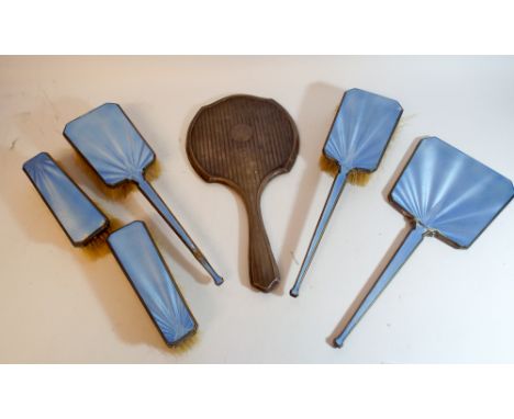 Pale blue enamel and silver backed dressing table set and another silver backed hand mirror