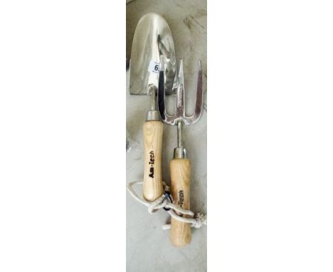 A stainless steel garden hand trowel and hand fork 
