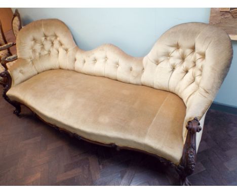 Victorian double ended sofa, the carved rosewood frame with shaped back raised on cabriole legs