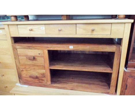 A light oak writing table or dressing table fitted three drawers 4' wide matching the previous lots 