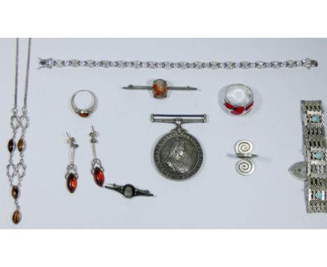 A collection of silver jewellery to include gate bracelet, CZ line bracelet, rings and other items.