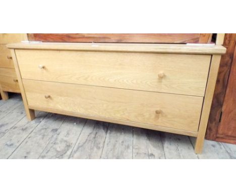 A long low light oak chest of two long drawers 4' wide 