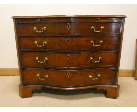 Gillows of Lancaster Georgian serpentine fronted mahogany chest of four long drawers with pull out slide fitted with brass dr