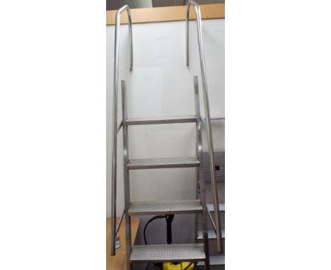 A heavy aluminium swimming pool ladder with six steps and handles 