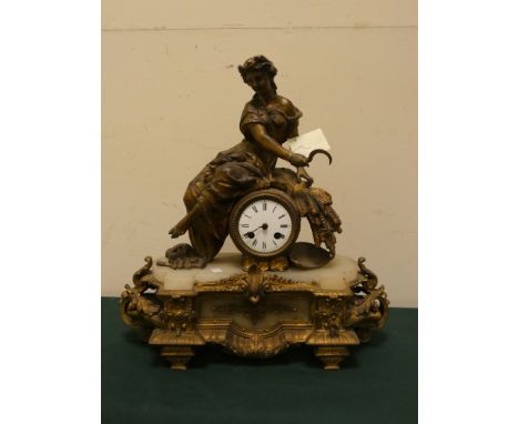 A French three piece clock garniture with figure mounted striking clock and a pair of cherub three branch candelabra 