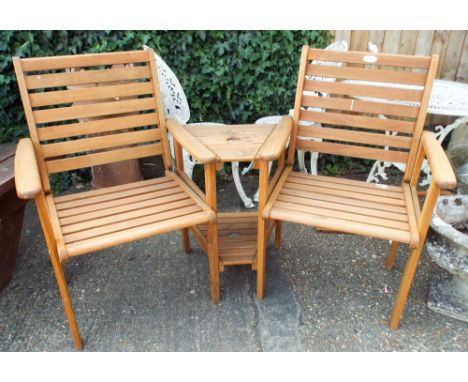 A wooden garden two seater bench with centre shelf 