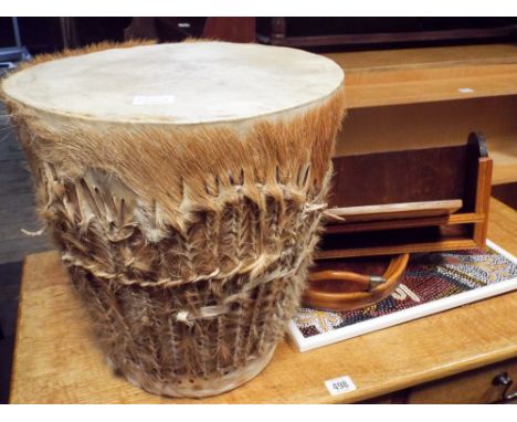 A Tom Tom drum, a tray, plaques, and a book trough