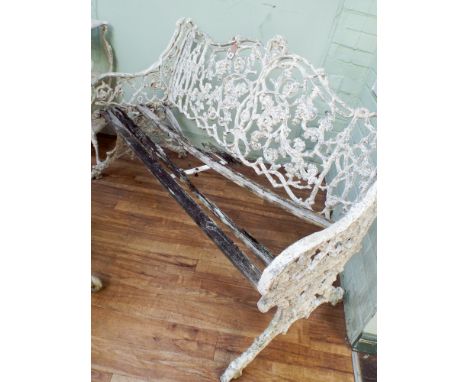 A Coalbrookdale style cast aluminum white painted garden seat with matching chair     Seat struts need replacing, metal work 